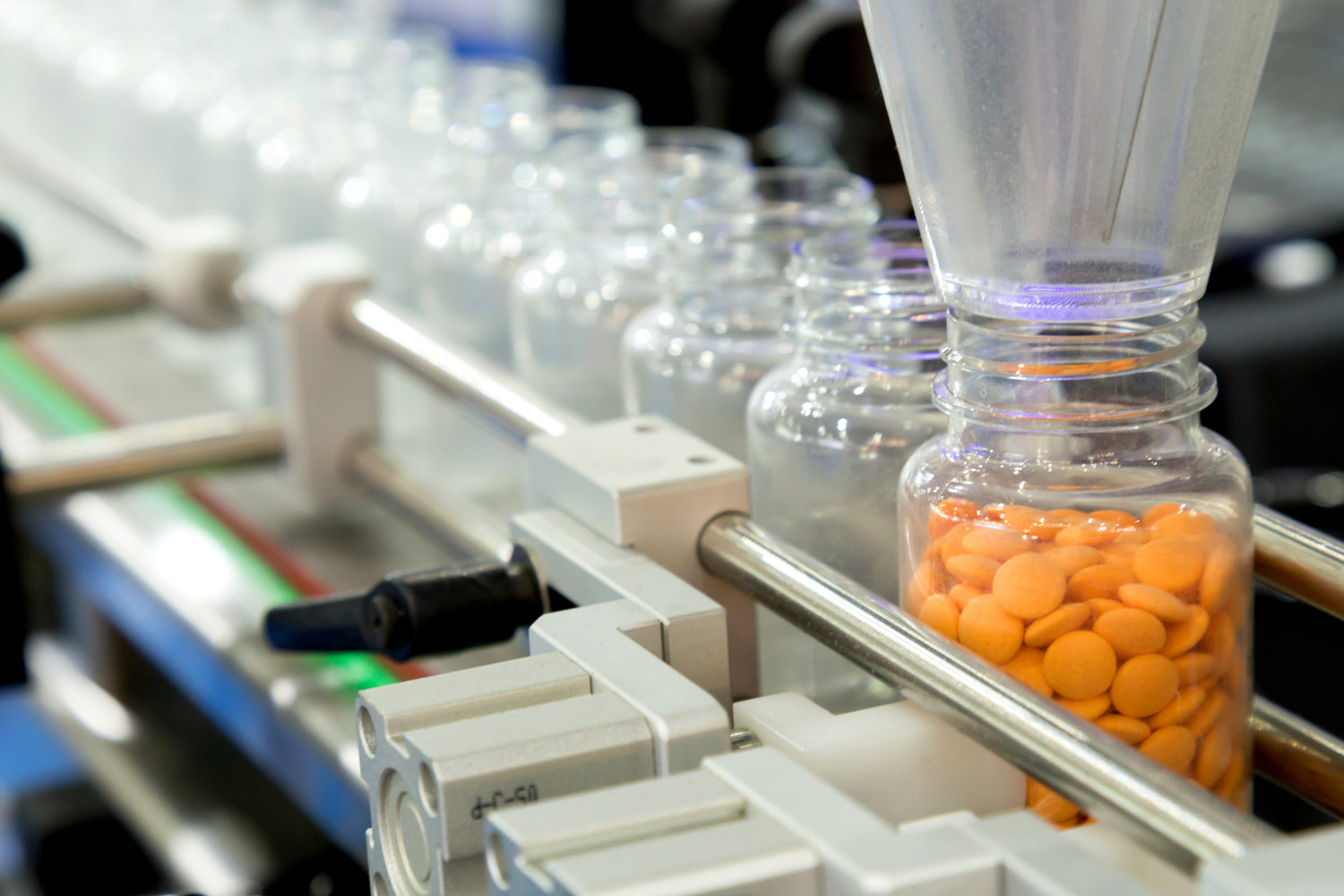 EW Packaging, food packaging distributors, supplement bottle conveyor in food processing,