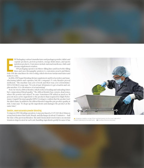 Laboratory worker in protective gear operating powder blending equipment for contract manufacturing